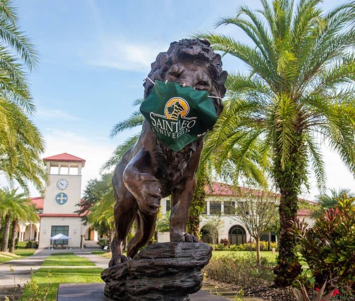 Lion sculpture wearing a mask