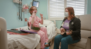 Music Therapist Kelli McKee works with Charlotte Bishop at Cardinal Glennon Children's Hospital in St. Louis, MO