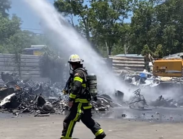 Firefighters Extinguish A Scrap Metal Fire Near Tampa International Airport