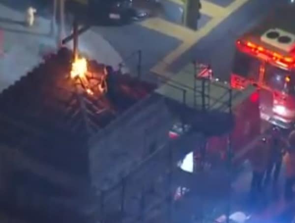 “Don’t Do It” Half-Naked Man Climbs Church Bell Tower, Lights Cross On Fire