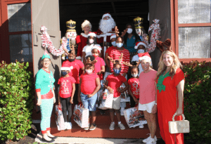 Santa Claus Hosts Disadvantaged Youth At Little Red School House