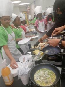 Embrace Girls prepare Green Eggs to compliment reading of Dr Seuss classic, Green Eggs and Ham.