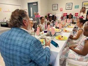 Embrace Girls listen attentively as Robert Zarco talks about his life.