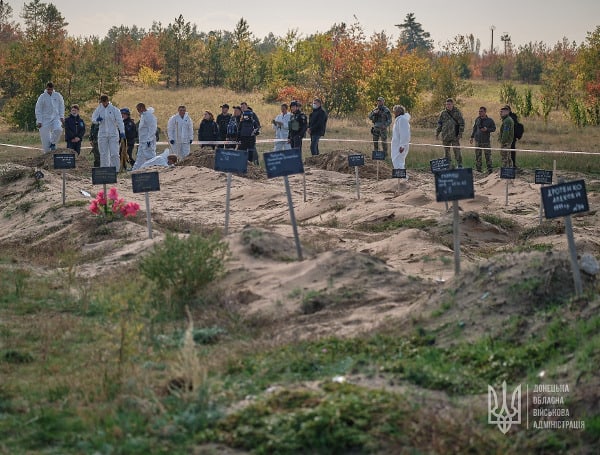 Ukraine’s Defense Ministry Says The First 20 Bodies In Lyman Exhumed From Mass Grave