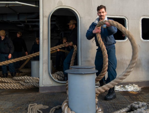 Military Recognition: Florida Native Slacks Off A Bollard Aboard Aircraft Carrier